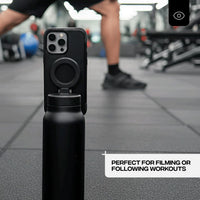 Black Footage Magna Bottle holding a phone to record training in a gym