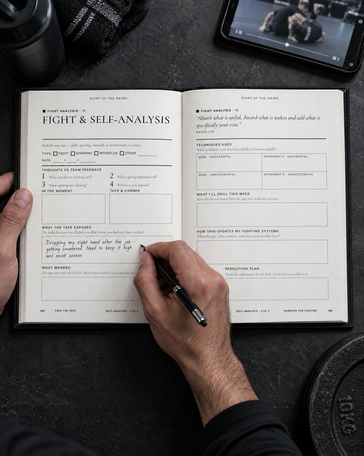 A fighter reviewing footage and writing in the DOTG Fight & Self-Analysis journal on page 280