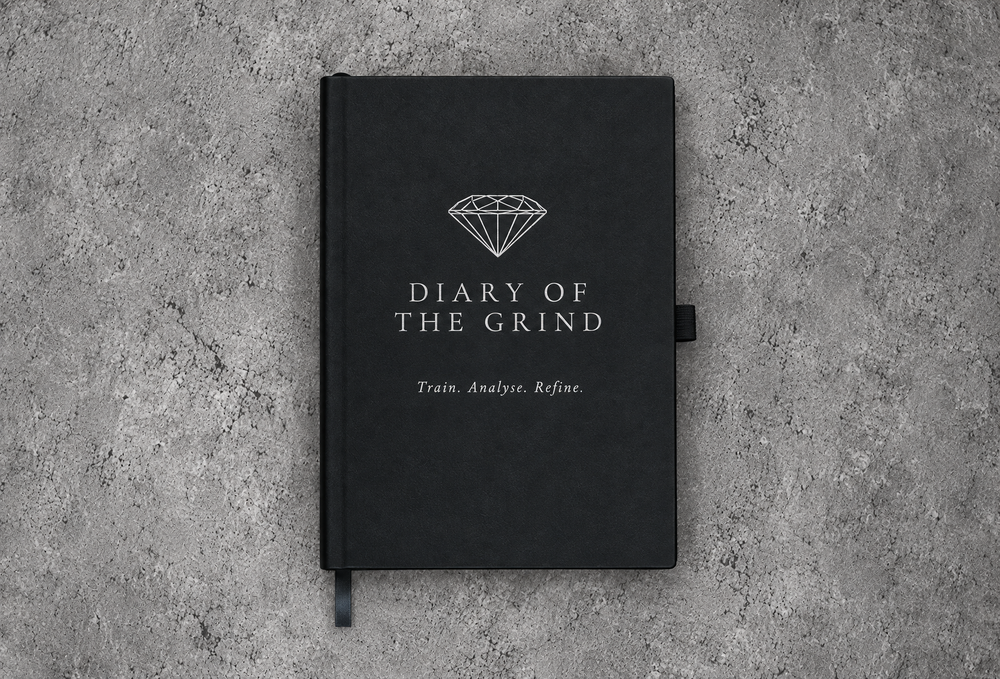 Black Diary of the Grind journal with silver diamond logo and Train. Analyse. Refine. cover lettering