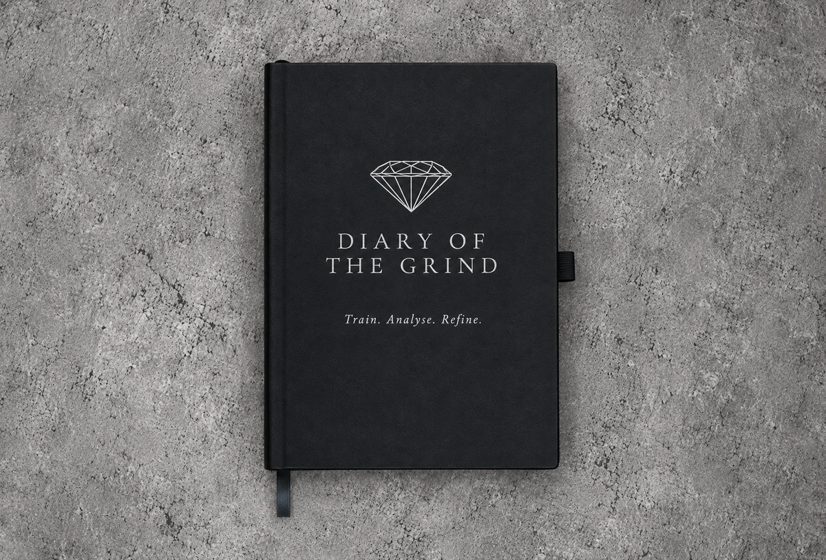 Black Diary of the Grind journal with silver diamond logo and Train. Analyse. Refine. cover lettering