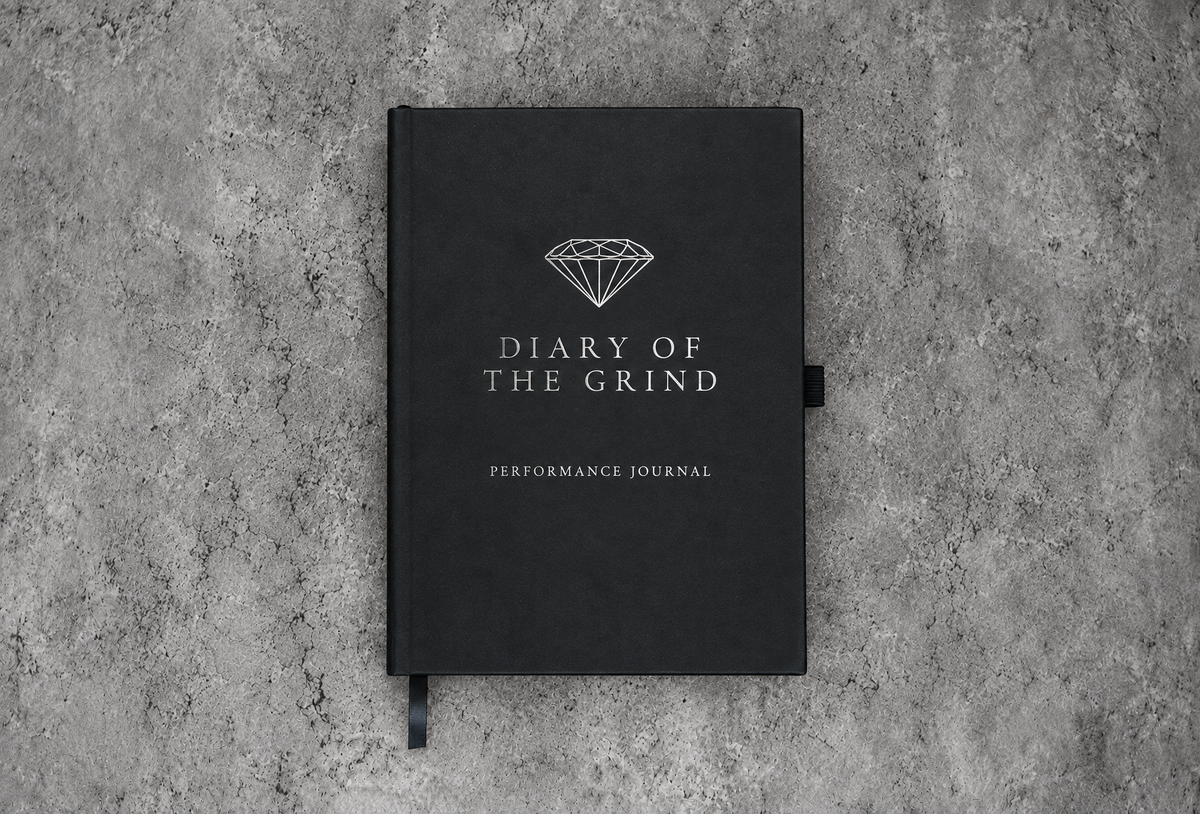 Black Diary of the Grind Performance Journal with silver branding